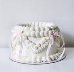 White buttercream birthday cake with pink bows Sydney next day delivery