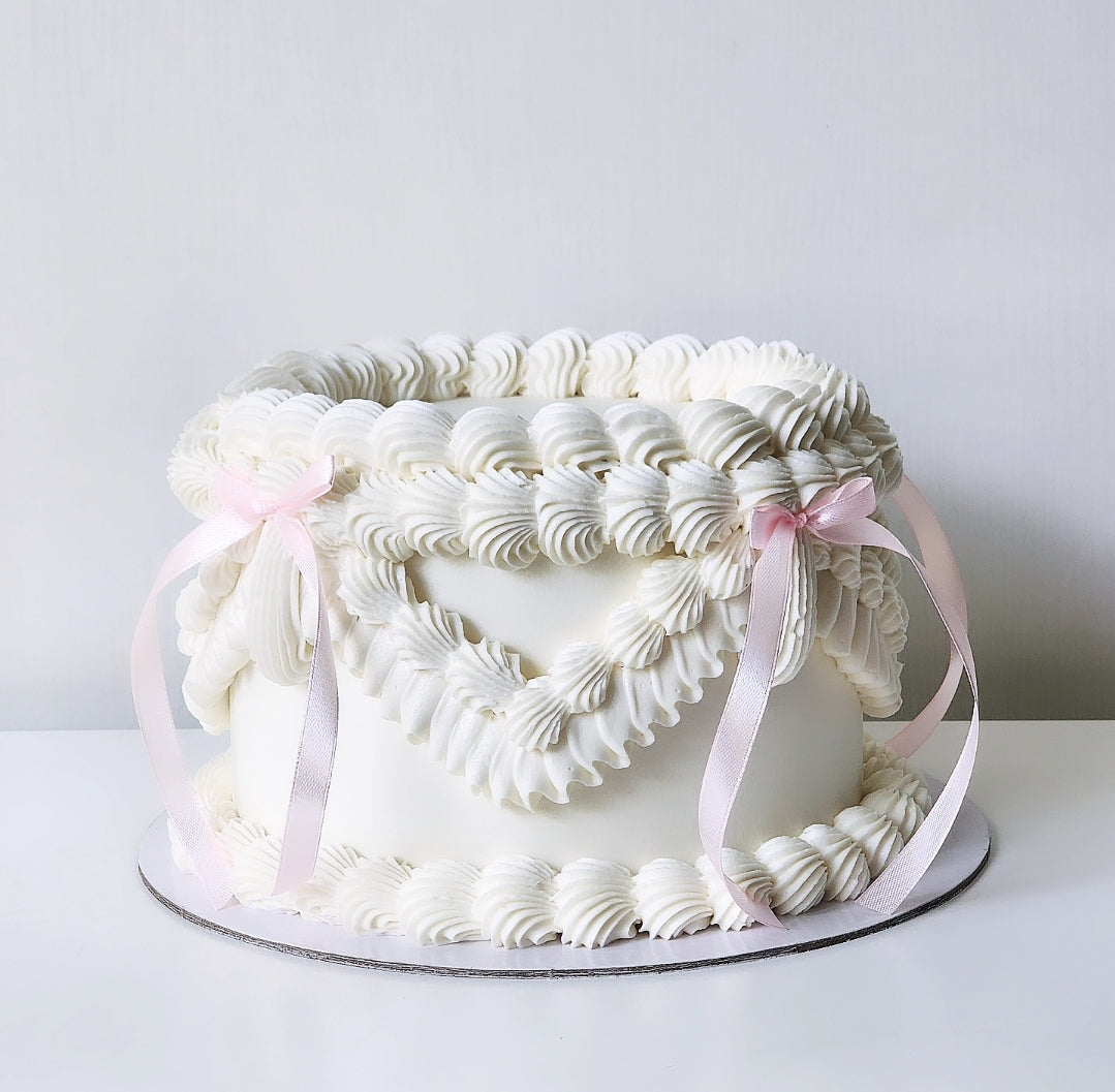 White buttercream birthday cake with pink bows Sydney next day delivery