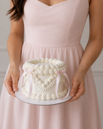 White vintage cake with pink bows sydney