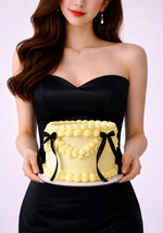Yellow cake with black ribbons sydney