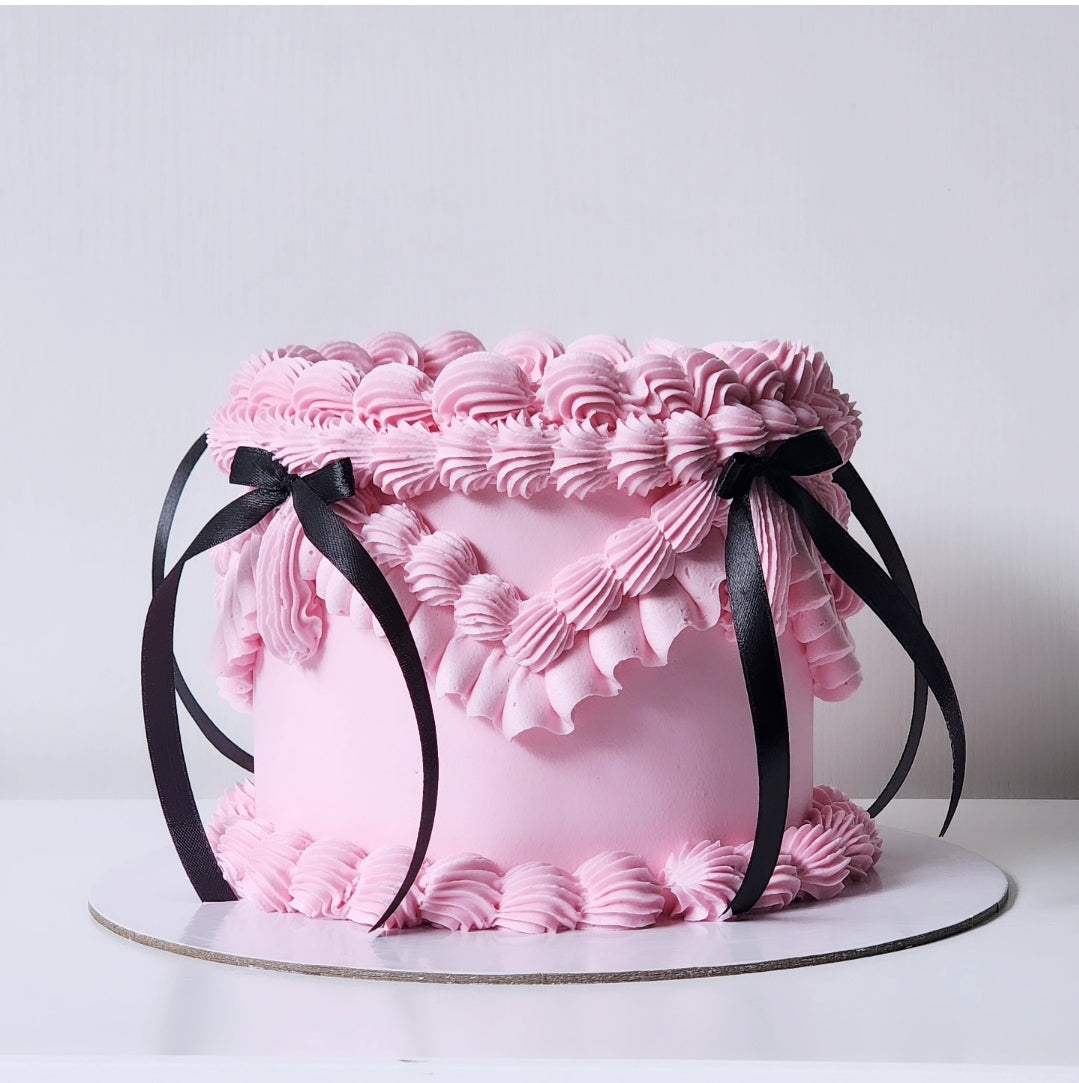 Pink buttercream birthday cake with black bow details Sydney next day delivery