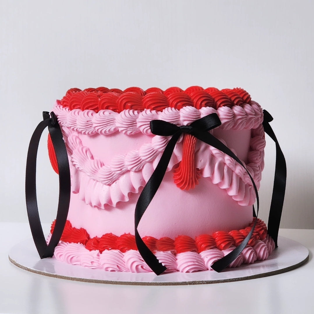 Pink and red buttercream birthday cake with black bow details Sydney next day delivery