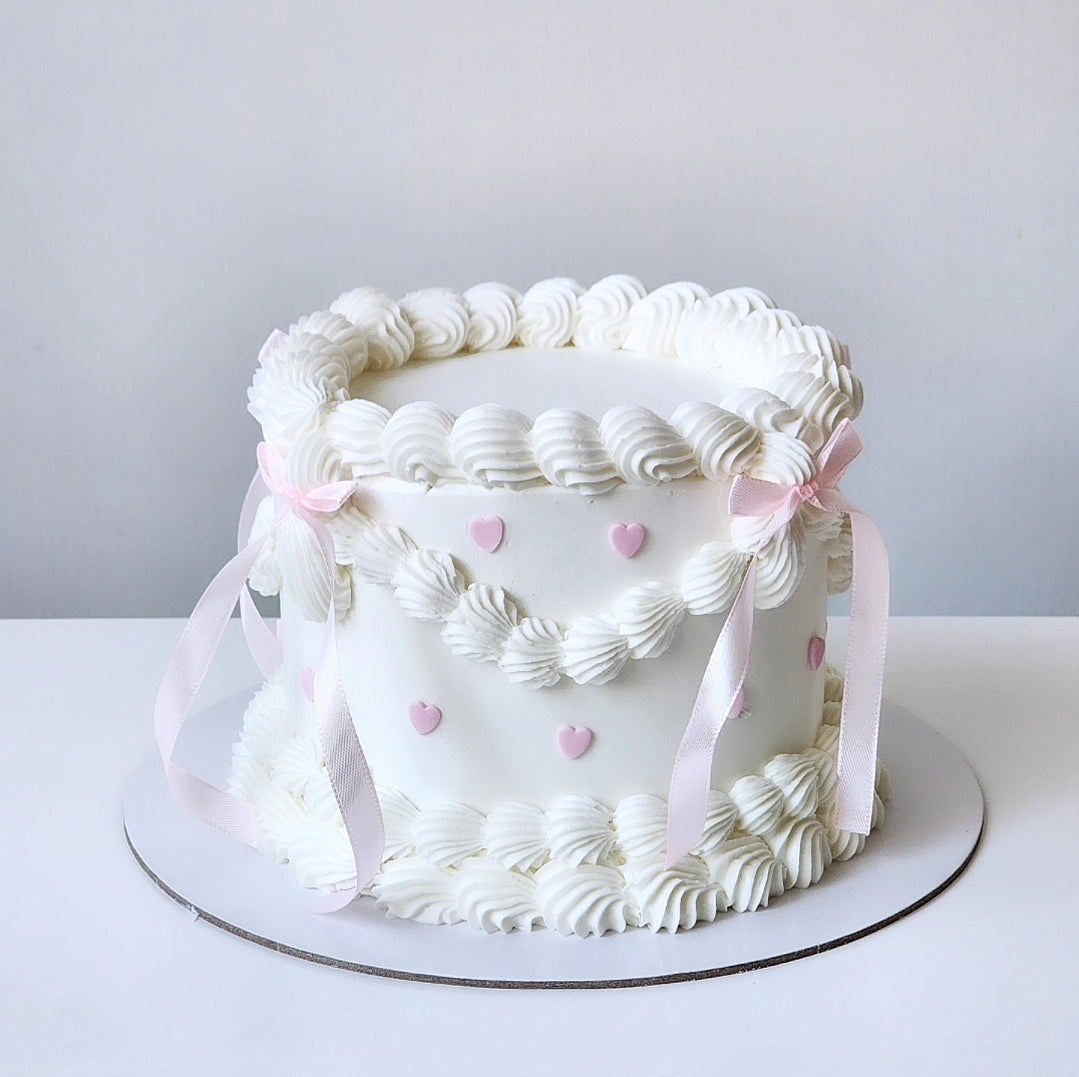 White buttercream birthday cake with pink heart details Sydney next day delivery